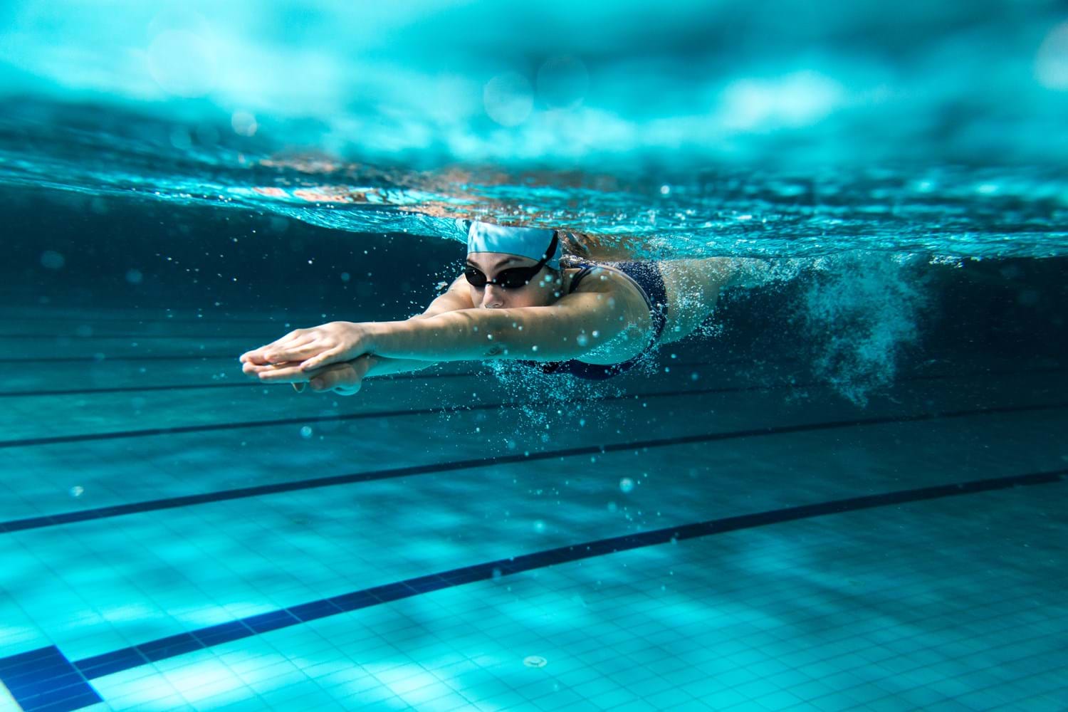 Woman Swimming In Pool